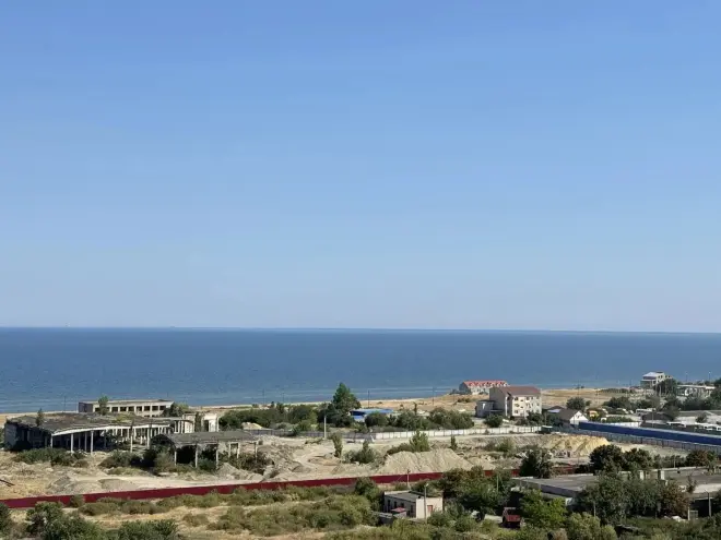 Иллюстрация из медиатеки ГРЦ. Природный пейзаж  с морем города Геническ